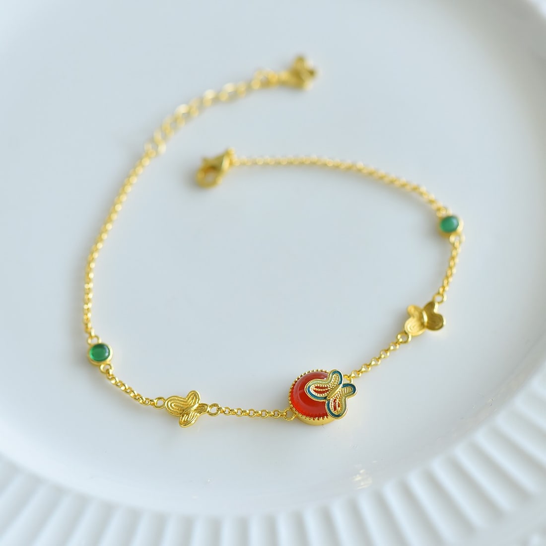 Silver Inlaid Red Agate Butterfly Bracelet: Title: Silver Inlaid Red Agate Butterfly Bracelet Description: This bracelet captures the essence of elegance with its simple yet exquisite design. The silver setting perfectly complements the