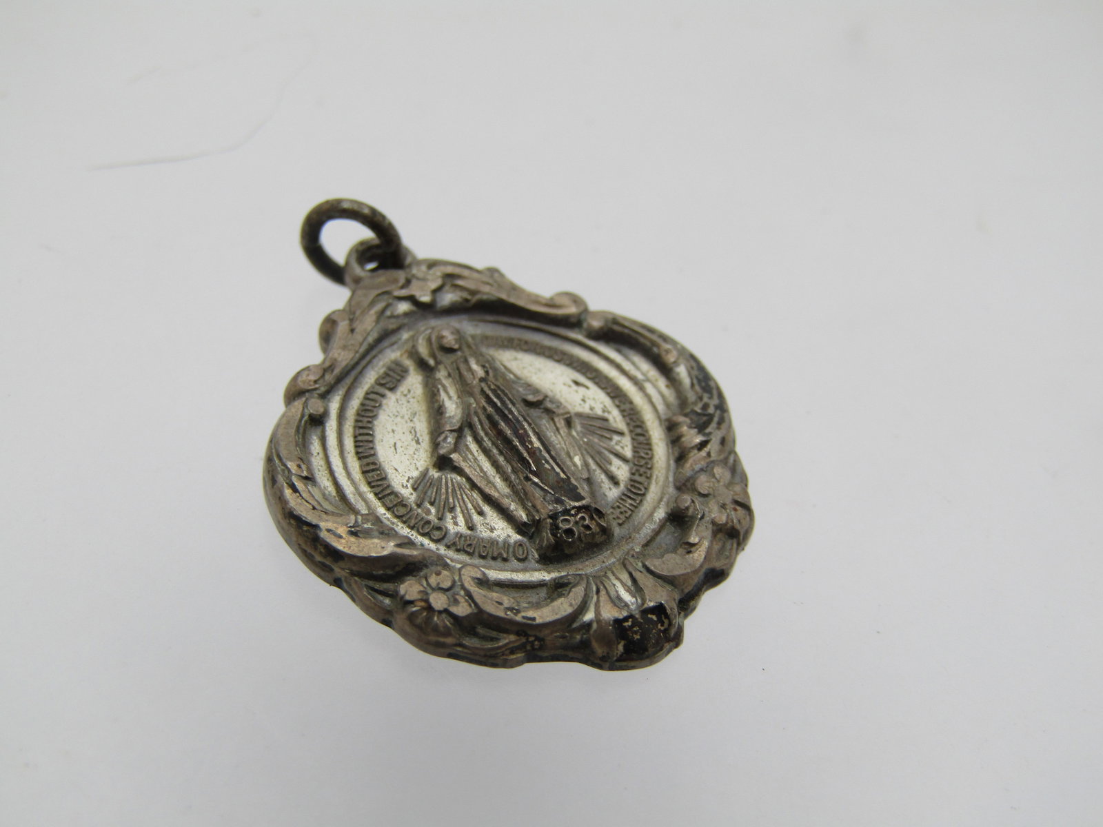 Vintage Sterling Blessed Mother Pendant, Signed Creed 1940's-1950's: Vintage Sterling Blessed Mother Pendant, Signed Creed 1940's-1950's. The pendant is very ornate compared to many, scrolled floral raised frame and the blessed mother is raised with a lower