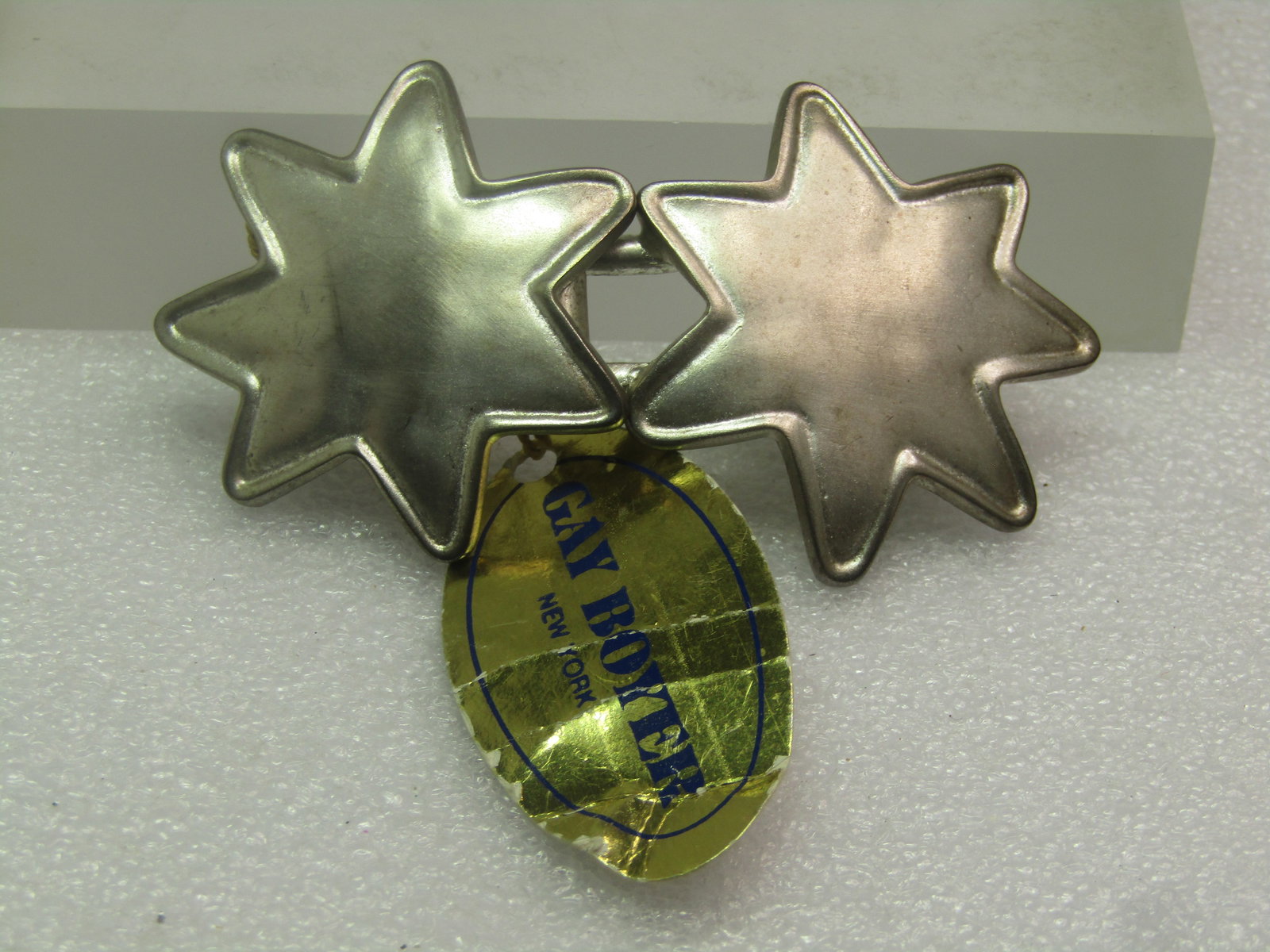 Vintage Silver Tone Star Inlocking Buckle Set, Gay Boyer New York, 1970's: Vintage Silver Tone Star Inlocking Buckle Set, Gay Boyer New York, 1970's. They are a satiny silver tone finish and slightly domed. In the connected position, they are appx. 3" wide and 1.5" tall.