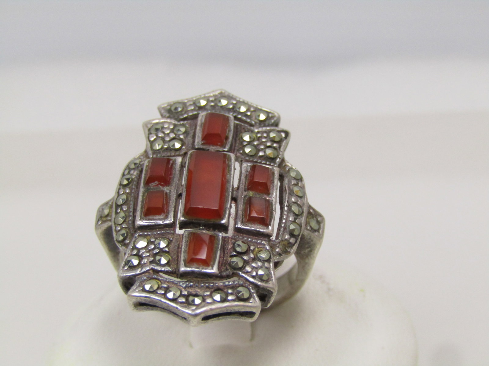 Vintage Sterling Carnelian Marcasite Ring, Sz. 7, 1980's or Earlier: Vintage Sterling Carnelian Marcasite Accent Ring, Sz. 7, 1980's or earlier. This is a long ring with curved and pointed from and back and rectangular shaped carnelian stones set in bezel-frames on the