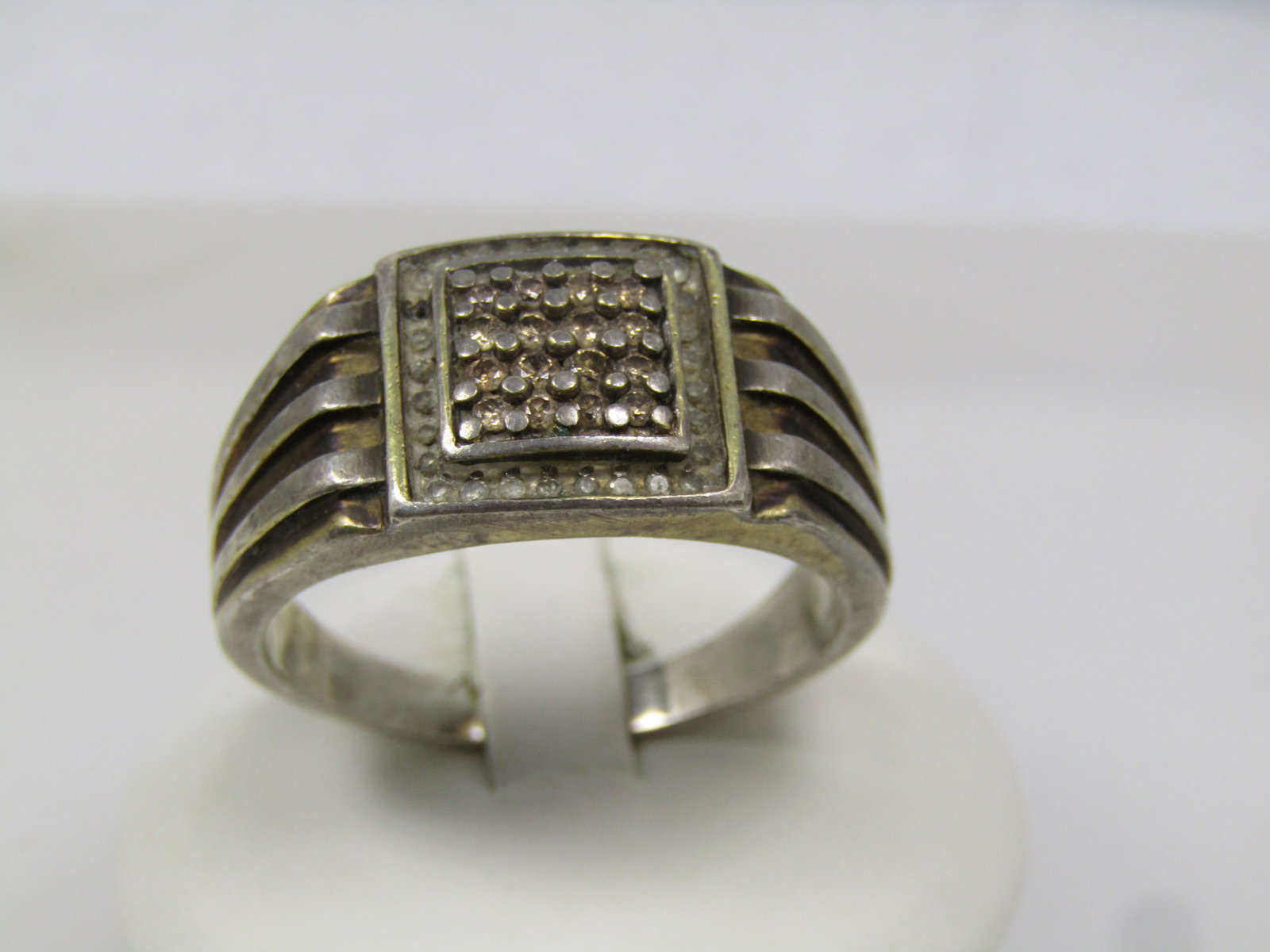 Vintage Sterling Diamond Ring, Men's, Sz. 15.5, 1950's-1960's: Vintage Sterling Diamond Ring, Men's, Sz. 15.5, 1950's-1960's. It is 13mm down the finger and crosses over appx. 13.8mm over the finger wher it meets a wide raised triple ridge band that is appx. 12mm