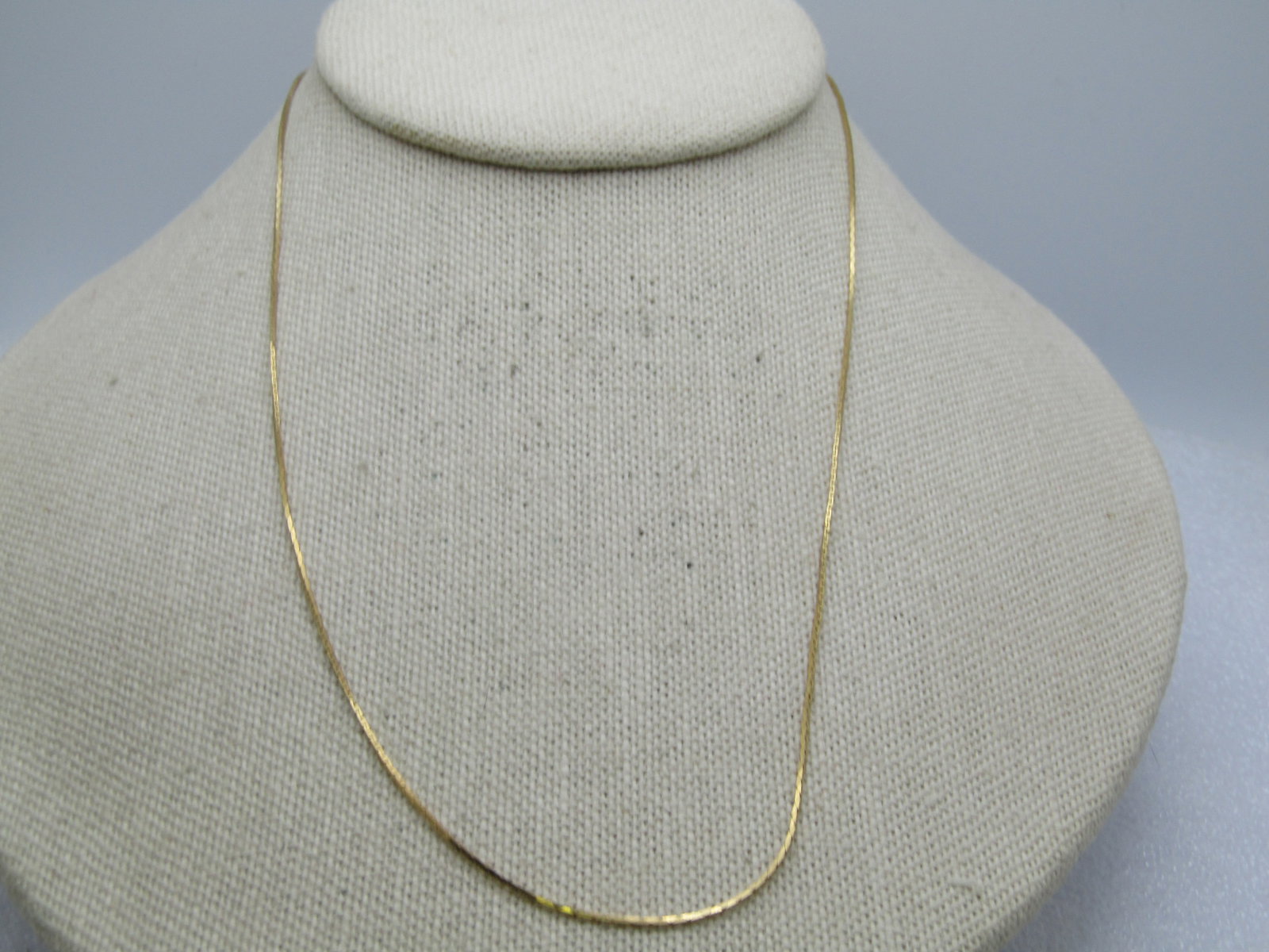 Vintage Danecraft Sterling Herringbone Necklace, Goldwashed, 20": Vintage Danecraft Sterling Herringbone Necklace, Goldwashed, 20". It is appx. 1mm herringbone chain with spring ring clasp. Signed Danecraft and marked .925 and Italy. Weight is appx. 2.10 gr. 