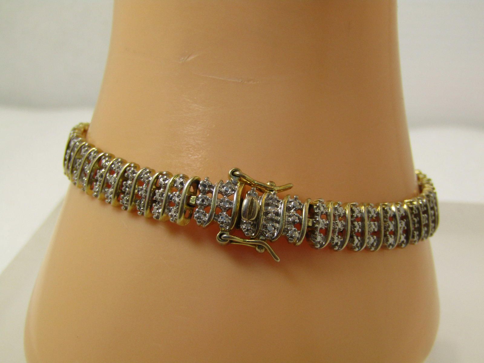 Vintage Sterling Vermeil Illusion Bracelet, 7.5", Signed, 1980's-1990's: Vintage Sterling Vermeil Illusion Bracelet, 7.5", Signed, 1980's-1990's. This is gold over sterlnig on the back and between the horizontal row of what looks like three small diamonds in each row - it