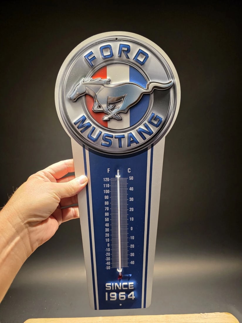 Ford Mustang American Thermometer Sign: Title: 17.5 " Metal Vintage Style Ford Mustang American Thermometer SignDescription: 17.5 This classic reproduction Ford Mustang thermometer is a must-have for any garage or man cave. Crafted from