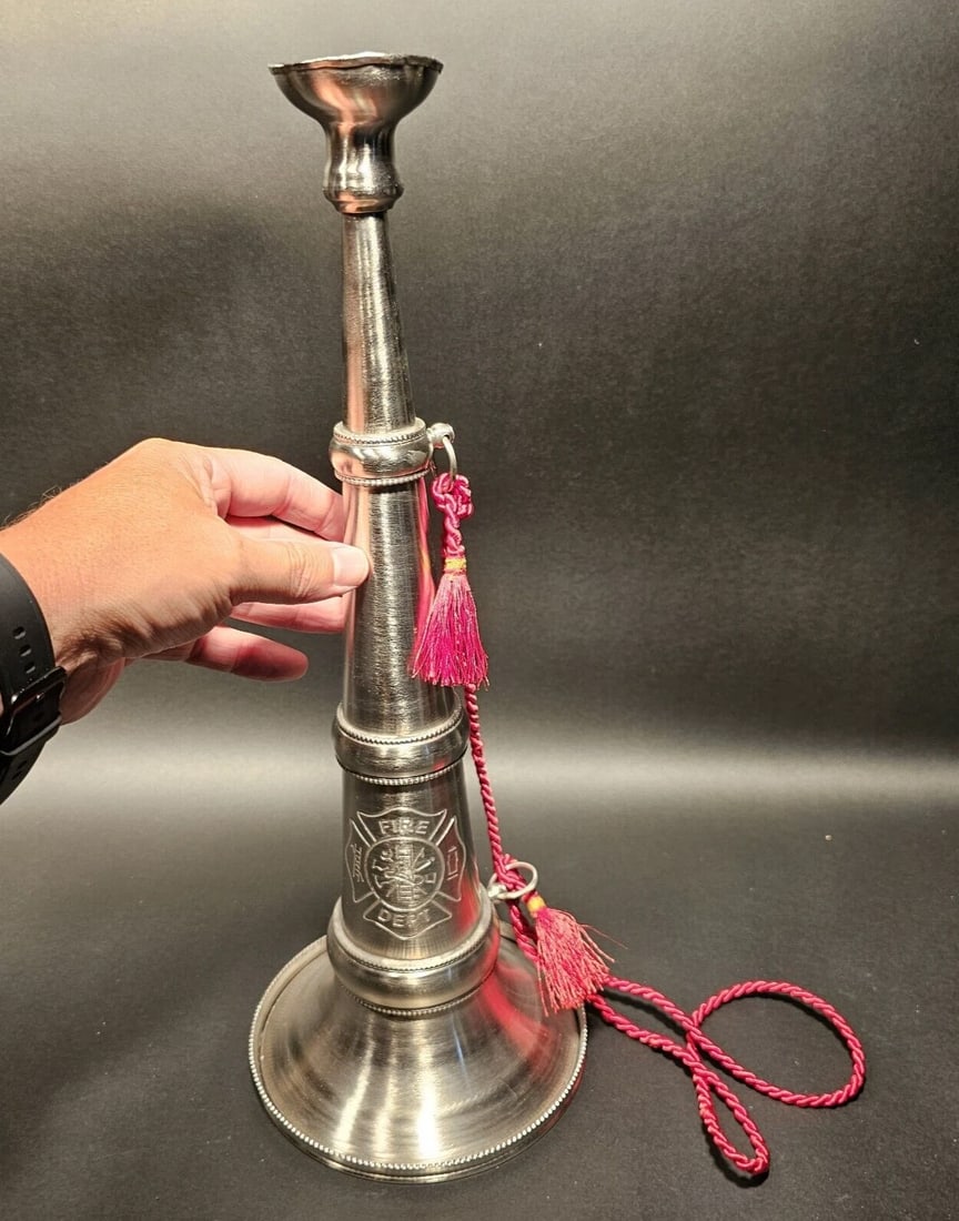 16 1/2" Silver Fireman Presentation Speaking Trumpet: Title: 16 1/2" Antique Style Silver Fireman Presentation Speaking TrumpetDescription: 16 1/2" Tall x 6 1/4" Wide Well made reproduction Fire Fighter presentation speaking trumpet. Be sure to see the