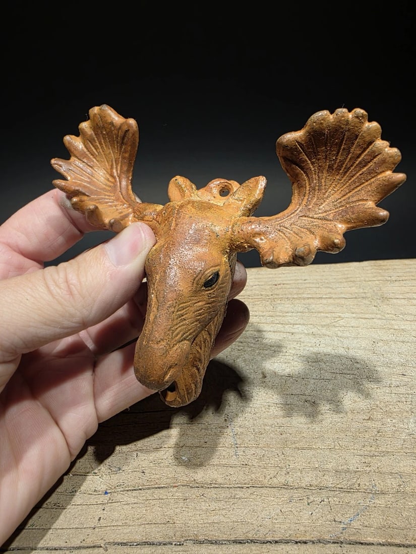 Cast Iron Moose Head Bar Bottle Opener: Title: Antique Vintage Style Cast Iron Moose Head Bar Bottle OpenerDescription: 5 1/4" tall, this cast iron bottle opener features a classic moose style. It is a new reproduction crafted with an