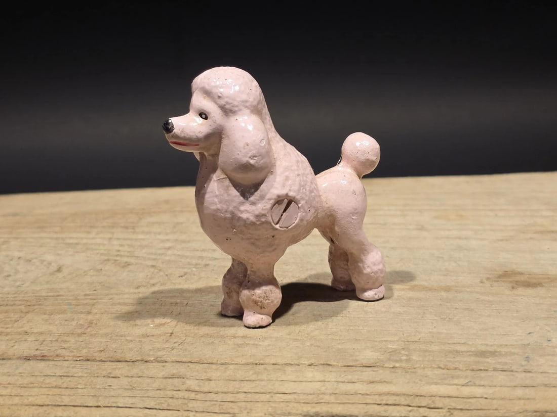 Cast Iron Poodle Dog Figurine Pink Poodle Statue: Title: Cast Iron Pink Poodle Dog Figurine – Vintage Style Poodle StatueDescription: Cast iron poodle dog figurine depicting the classic standard poodle grooming style with clipped coat and