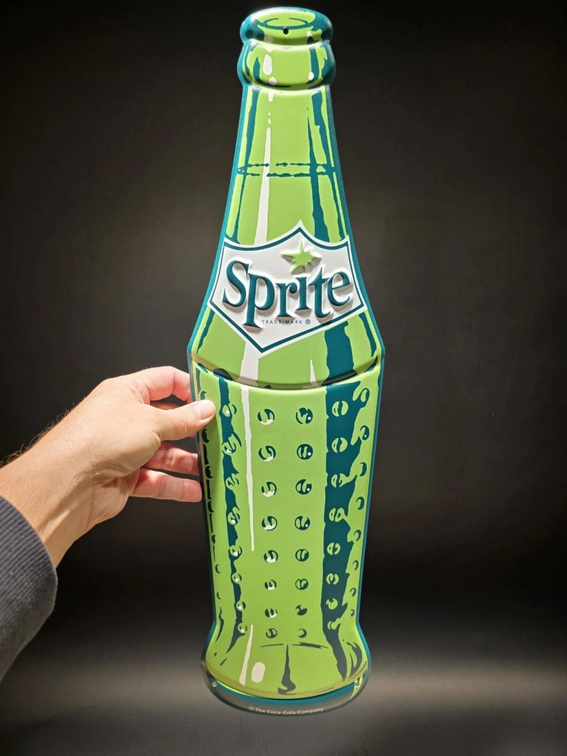 22" Vintage Style Metal Die Sprite Bottle Sign: Title: 22" Vintage Style Metal Die Sprite Bottle Sign Description: 22" Long x 6" Wonderful reproduction Coca Cola sign. Good detail styled to look vintage. Certainly hard to tell its age. Reserve: $2