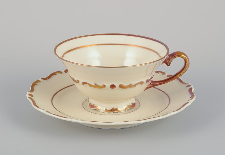 A set of six KP, Karlskrona tea cups with saucers in cream-colored porcelain with gold decoration. - 2