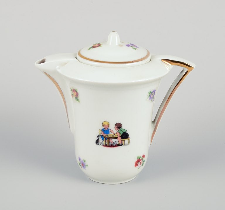 French dolls dinnerware/childrens tea set in porcelain. Coffee pot and sugar bowl along with one - 2