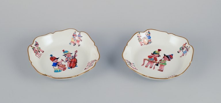 Limoges, France. Two deep childrens plates in porcelain. Gold rim. Motifs of child musicians. (1 of 8)