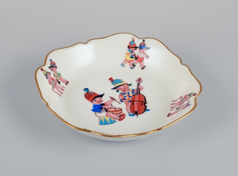 Limoges, France. Two deep childrens plates in porcelain. Gold rim. Motifs of child musicians. - 2
