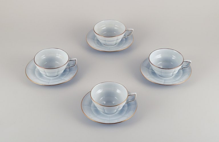 Gefle, Sweden, a set of four "Grand" Art Deco teacups with matching saucers. Light blue faience with - 2