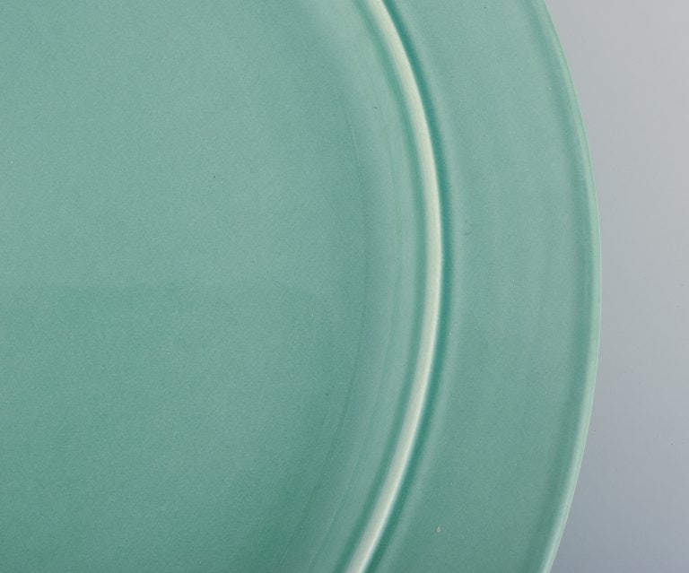 Royal Copenhagen, "4 All Seasons". A set of four dinner plates in faience with green glaze. - 4