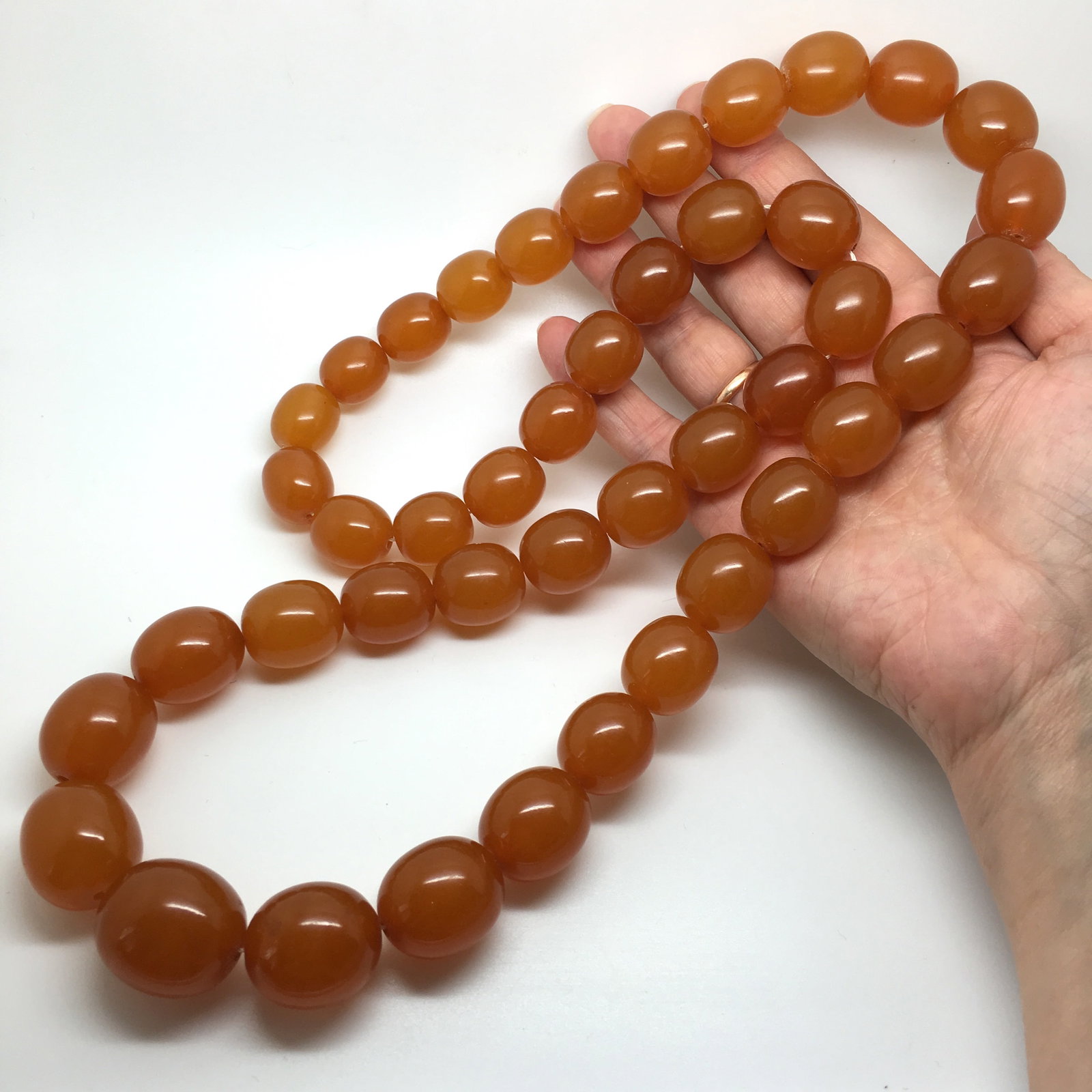 Staggering Unique Vintage Amber Necklace made from Olive shaped Amber beads: Title:Staggering Unique Vintage Amber Necklace made from Olive shaped Amber beads Metal:None Gemstone:Amber Weight:159.95 g Size:Bead size: 22.4 x 25.4 mm Bead size: 0.882 x 1.0 inches Made of:(Recons