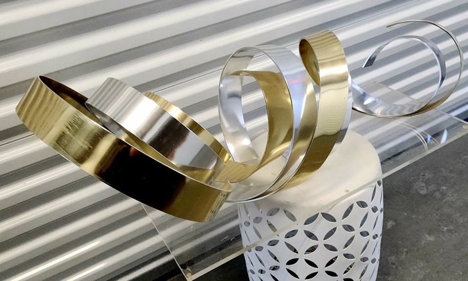 Large epic 40"w MCM Dan Murphy ribbon metal sculpture on clear luciite base. A collector level work. - 2