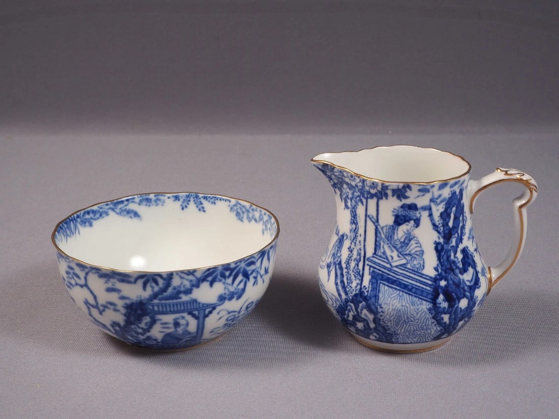 Royal Crown Derby Blue Mikado Milk Jug Creamer Open Sugar Bowl Bone china: Title: Royal Crown Derby Blue Mikado Milk Jug Creamer Open Sugar Bowl Bone china Description: . The Mikado pattern was designed in 1894 by Royal Crown Derby’s art director, Thomas Amos Reed. It