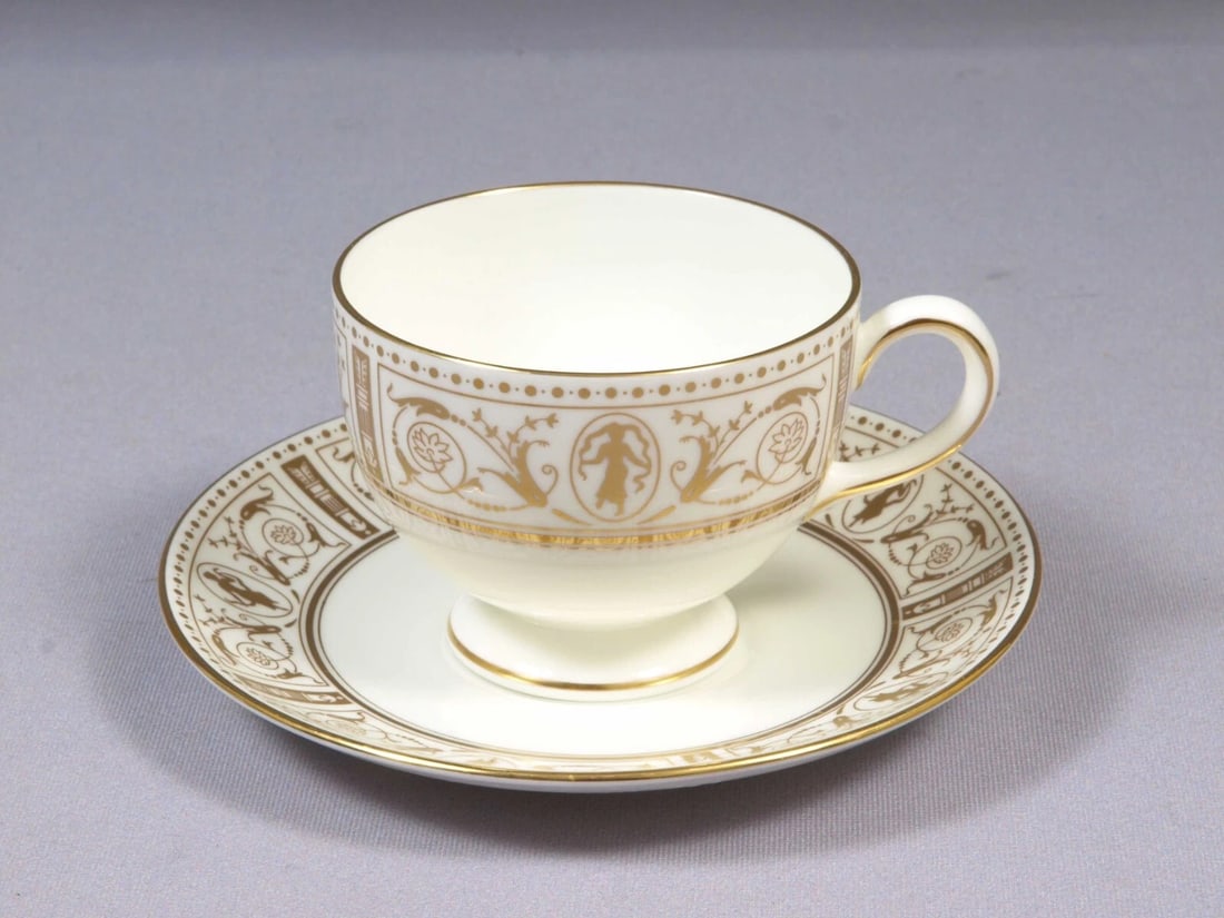 Wedgwood GOLD GRECIAN Coffee Tea Cup Saucer Set England: Title: Wedgwood GOLD GRECIAN Coffee Tea Cup Saucer Set England Description: . This very rare and beautiful Coffee/Tea cup and Saucer Set made by WEDGWOOD in GOLD GRECIAN pattern with gold figures and