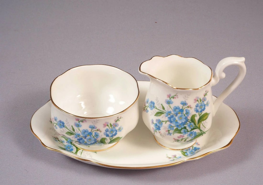 Royal Albert Forget me Not England Vintage Creamer Jug Sugar Bowl Plate: Title: Royal Albert Forget me Not England Vintage Creamer Jug Sugar Bowl Plate Description: This is a gorgeous Bone China Creamer and Sugar Bowl Set with Under Plate from the renowned Royal Albert