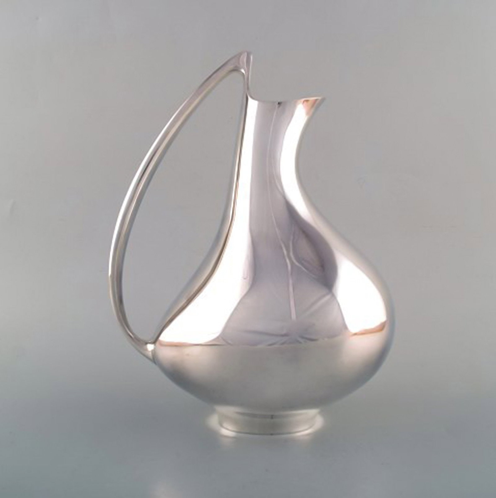 Henning Koppel for Georg Jensen. Modernist sterling silver jug. 'The Pregnant Duck'. Model number - 2