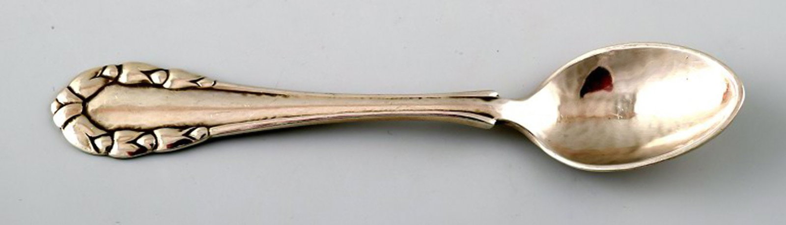 Georg Jensen Lily of the valley silver coffee spoon.: Title:Georg Jensen Lily of the valley silver coffee spoon. Description:Georg Jensen Lily of the valley silver coffee spoon. Measures 10.5 cm. In good condition. Early stamp. Reserve: $35.00 Shipping: