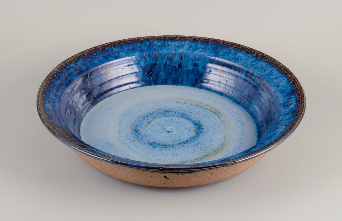 Frank Tromborg, Danish ceramist. Own workshop. Colossal ceramic bowl in bluish hues.: Title: Frank Tromborg, Danish ceramist. Own workshop. Colossal ceramic bowl in bluish hues. Description: Frank Tromborg (b. 1937), Danish ceramist. Own workshop. Colossal unique ceramic bowl. Glaze