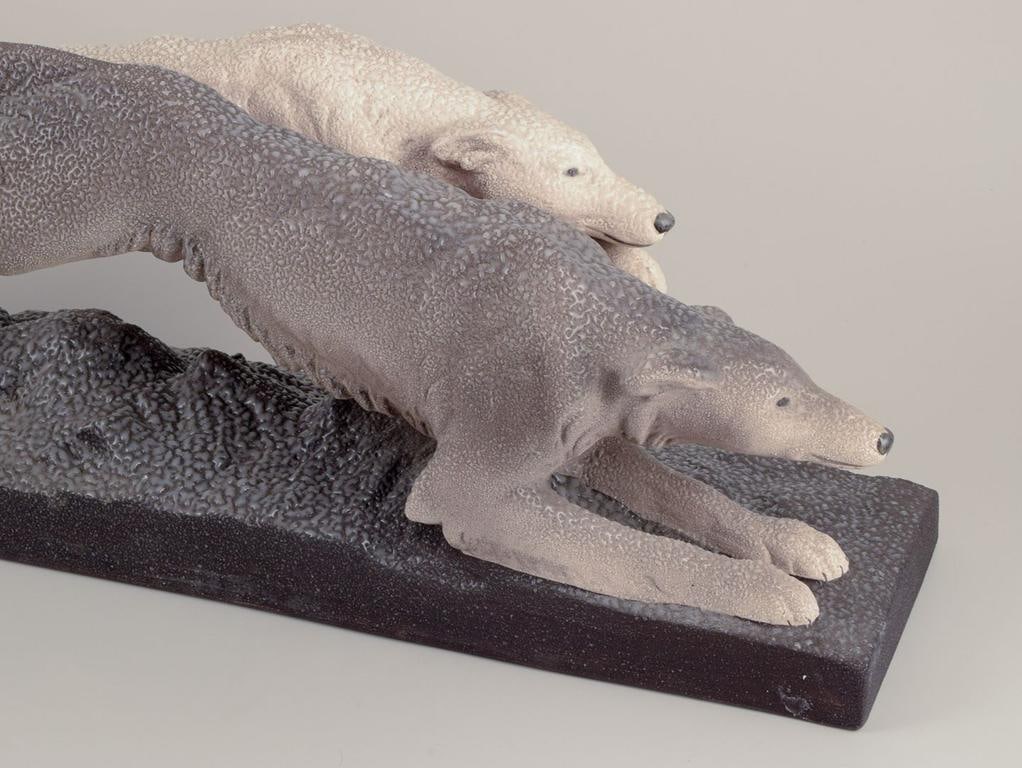Sevres Vinsare, France. Colossal ceramic sculpture of two running greyhounds. Approx. 1930 - 2