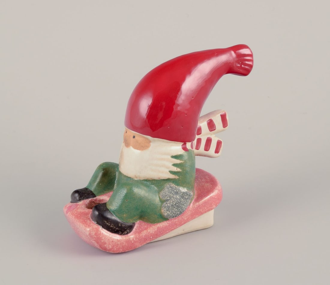 Lisa Larson for Gustavsberg. Candlestick holder. Elf on a sledge. Late 20th C. (1 of 6)