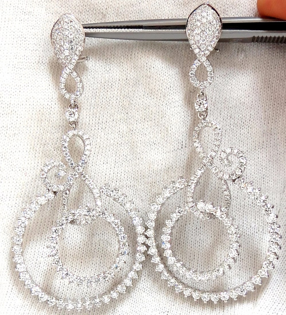 5.50ct NATURAL ROUND DIAMONDS SWIRL CIRCLE DANGLE EARRINGS 18KT**: Title: 5.50ct NATURAL ROUND DIAMONDS SWIRL CIRCLE DANGLE EARRINGS 18KT** Description: Magnificent Jewels. Wide circle swirl dangle earrings The Modern Finish. 5.50cts of natural round diamonds: