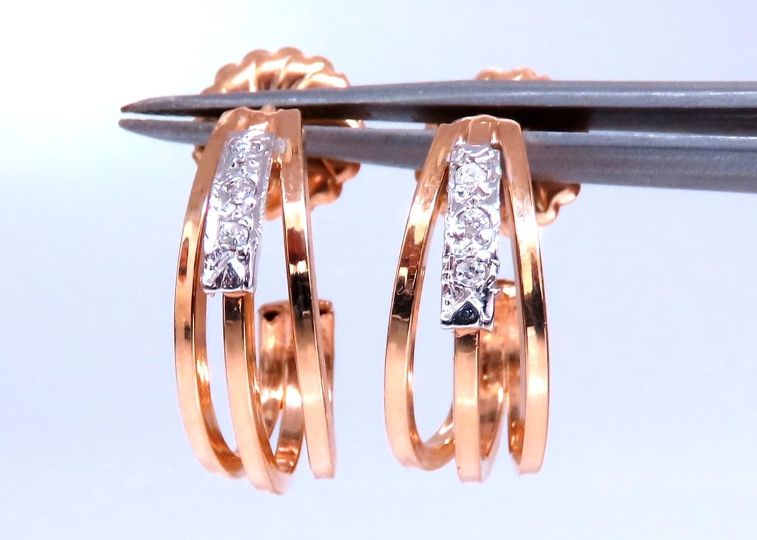 .06ct Natural diamond earrings 14kt yellow gold**: Title: .06ct Natural diamond earrings 14kt yellow gold** Description: Hoop Form diamond earrings. .06 carat natural round diamonds H - color si-1 clarity 14 karat white gold 3.6 grams Earrings measure