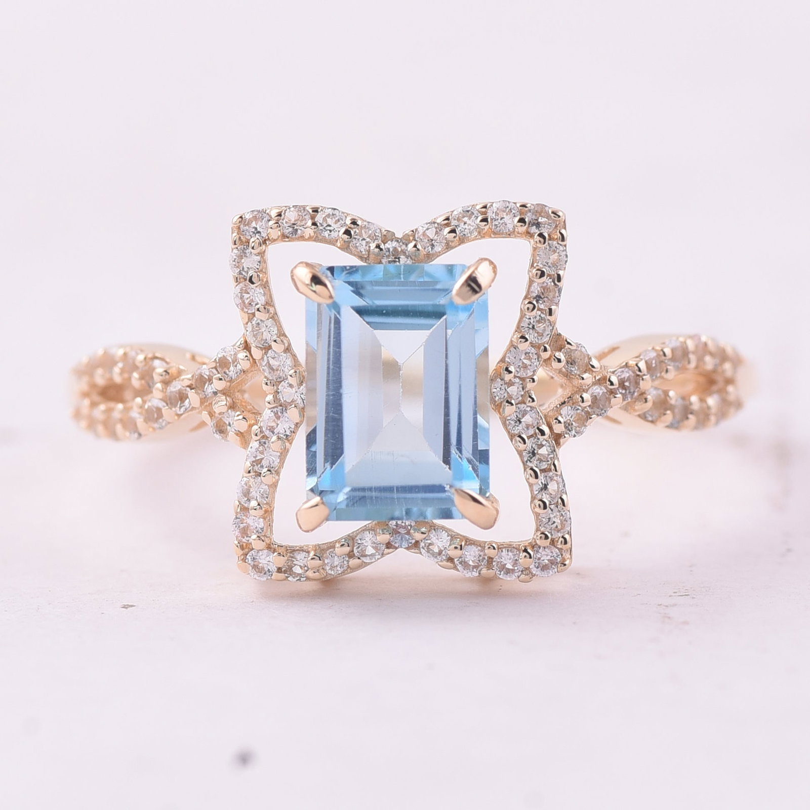 1.67 Ct Octagon Blue Topaz 9K Gold Ring: 1.67 Total Carat Blue Topaz 9K Gold Ring Specifications - Total Weight 2.06 g - Center Gemstone Blue Topaz - Gemstone Carat Weight 1.38 Carats - Gemstone Measurements 7X5 mm - Additional