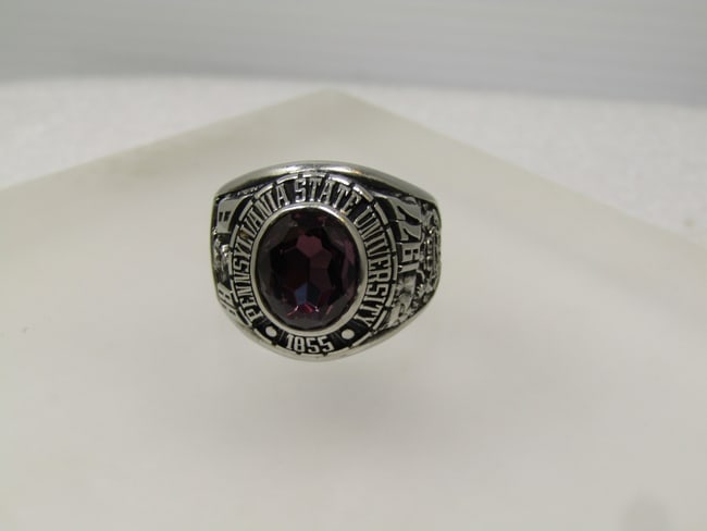 Vintage PSU 1977 Class Ring, Sz. 11.75, Siladium, Penn State Unsiversity, Signed ArtCarved: Vintage PSU 1977 Class Ring, Sz. 11.75, Siladium, Penn State Unsiversity, Signed ArtCarved. This has a purple faceted stone that is testing as Spinel or Topaz on the Presidium. The stone is oval and a