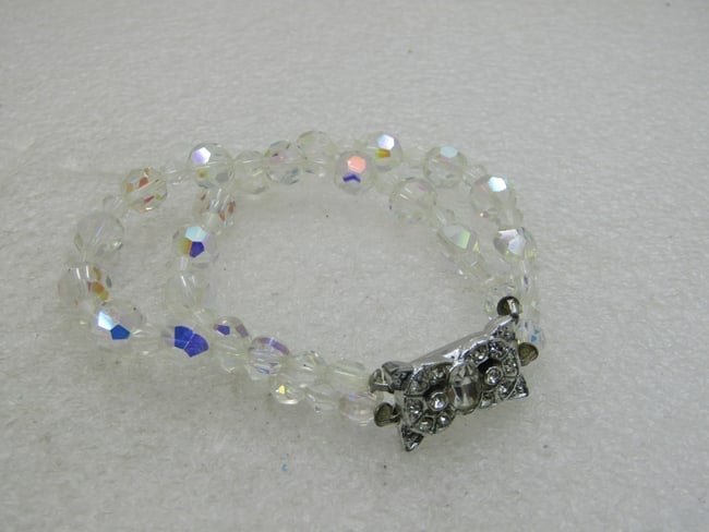 Vintage Double Strand Crystal Beaded Bracelet, 7.5", Aurora Borealis: Vintage Double Strand Crystal Beaded Bracelet, 7.5", Aurora Borealis, Art Deco with fancy rhinestone rectangular ornate clasp. Ppxz. 1/2" wide with round 7.5mm beads and diamond-shaped beads between.
