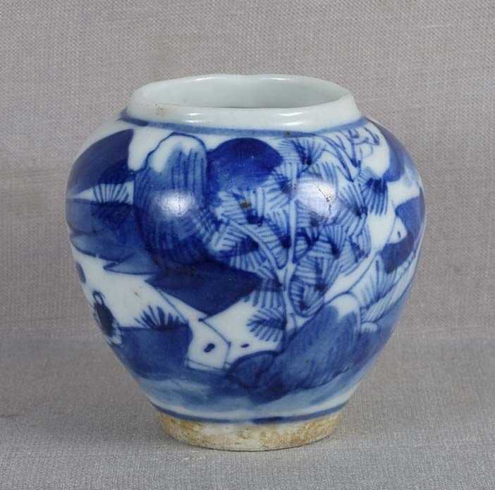 19c Chinese scholar porcelain BIRD CAGE FEEDER / water cup: 19th century Chinese porcelain bird feeder / water cup of jar shape to be hung in a bird cage. Wonderful quality underglaze blue painting of a scholarly landscape with trees, distant mountains and a s