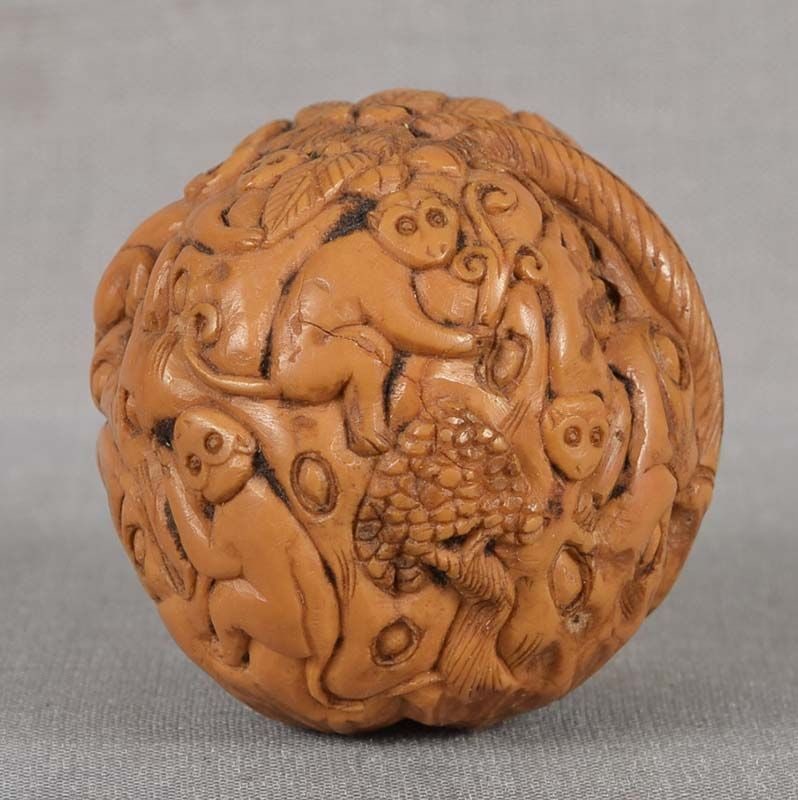 19c Chinese scholar WALNUT fingering piece MONKEYS on palm: Late Qing Dynasty (1890s to 1911) Chinese fingering piece in a form of a natural walnut carved with numerous monkeys in different attitudes among smaller trees and the tall palm. Unusually fine qualit