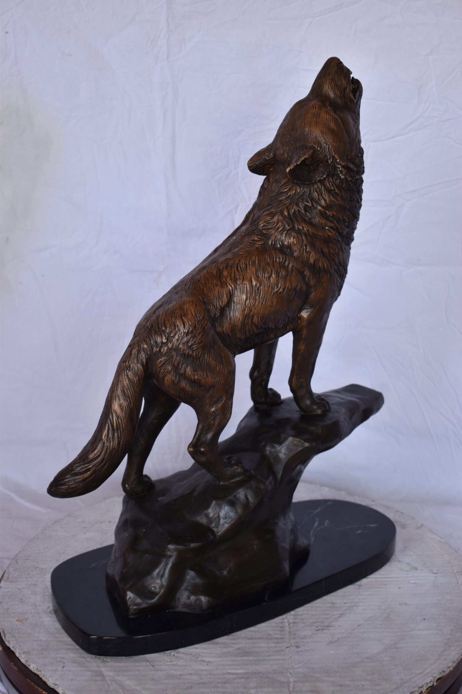 Howling Wolf at Edge of a Cliff Bronze Statue - Size: 9"L x 20"W x 26"H. - 10