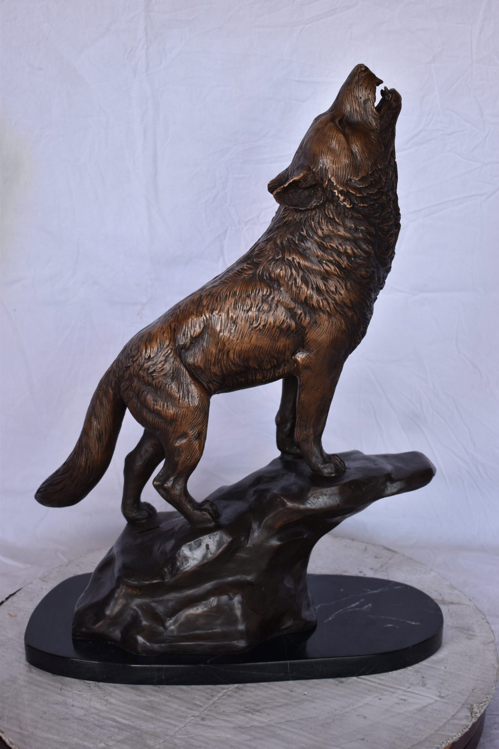 Howling Wolf at Edge of a Cliff Bronze Statue - Size: 9"L x 20"W x 26"H. - 11