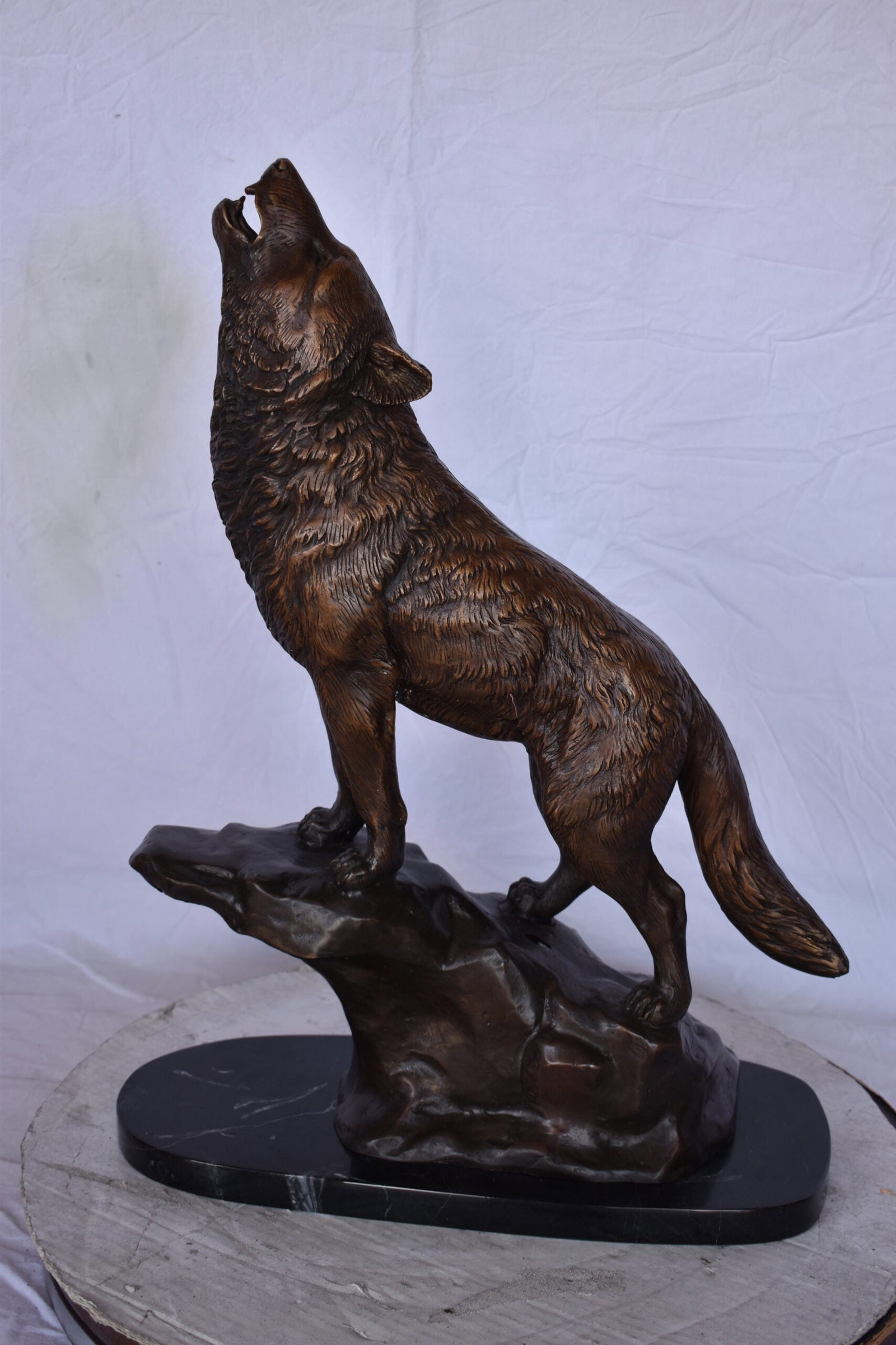 Howling Wolf at Edge of a Cliff Bronze Statue - Size: 9"L x 20"W x 26"H. - 7