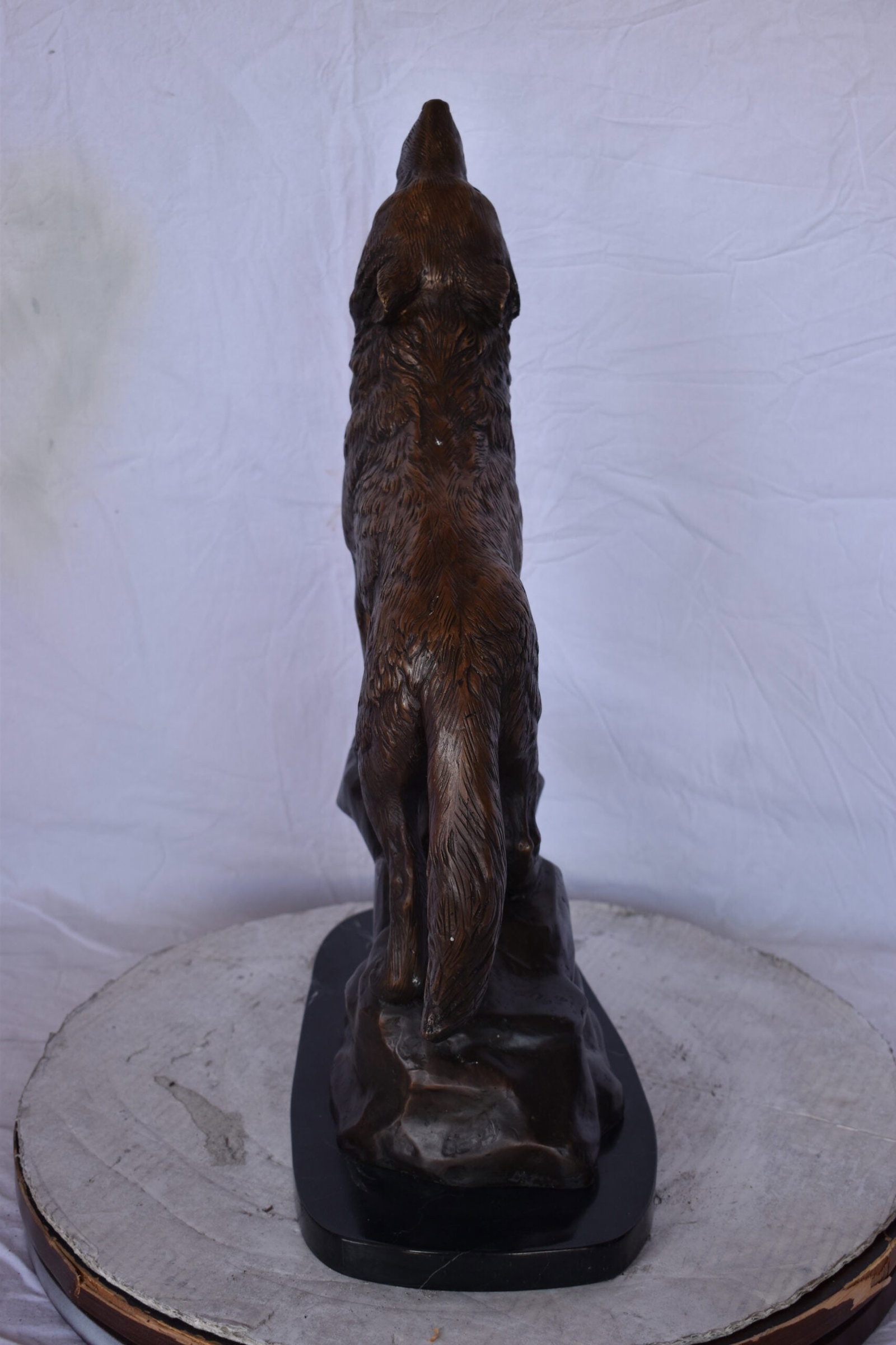 Howling Wolf at Edge of a Cliff Bronze Statue - Size: 9"L x 20"W x 26"H. - 9