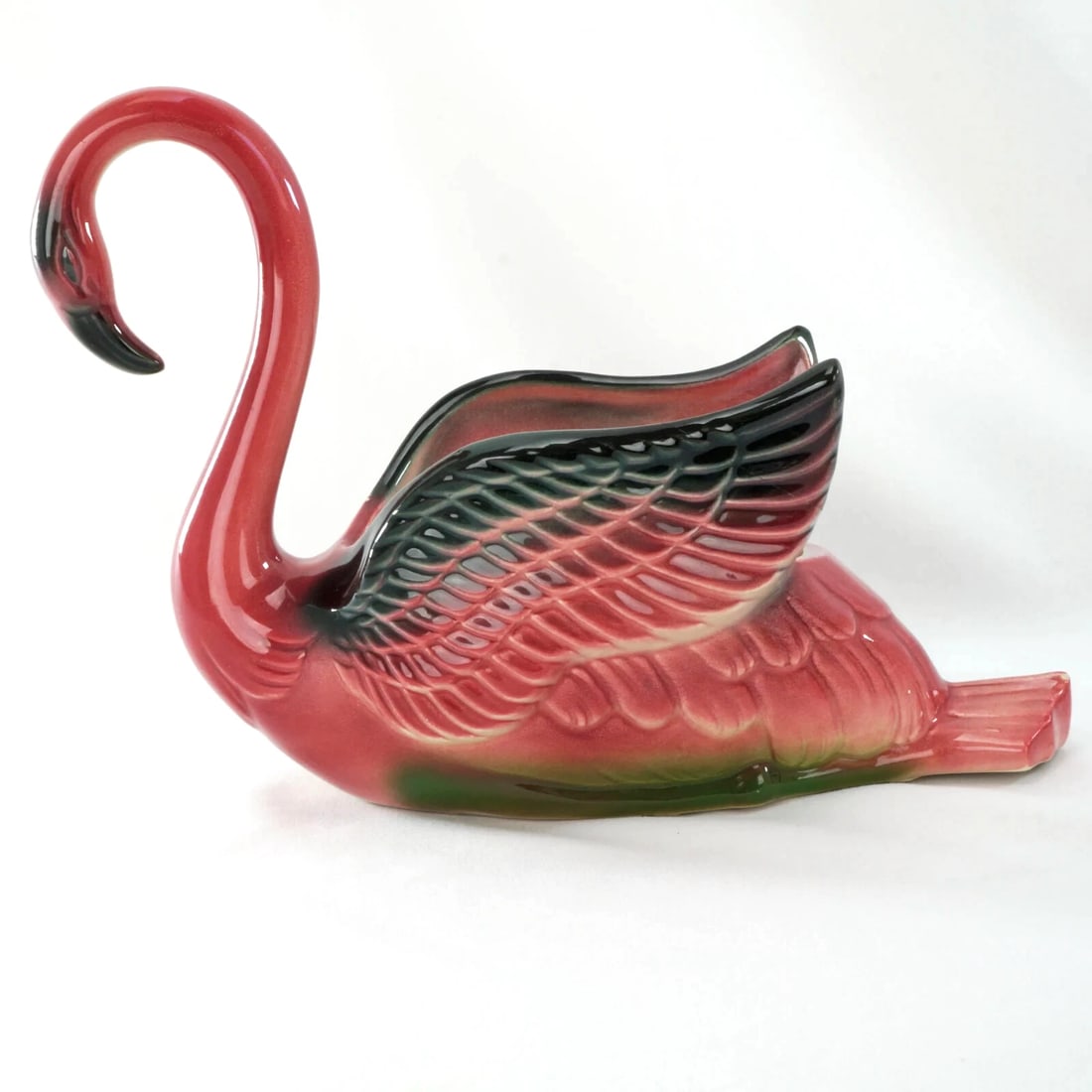 Royal Copley MCM Pink Flamingo Planter: Title:Royal Copley MCM Pink Flamingo PlanterSize:9 ¾ in (24.8 cm) long x 4 in (10.2 cm) wide x 7 in (17.8 cm) tall.Description:A colorful and nostalgic pink flamingo planter by Royal Copley