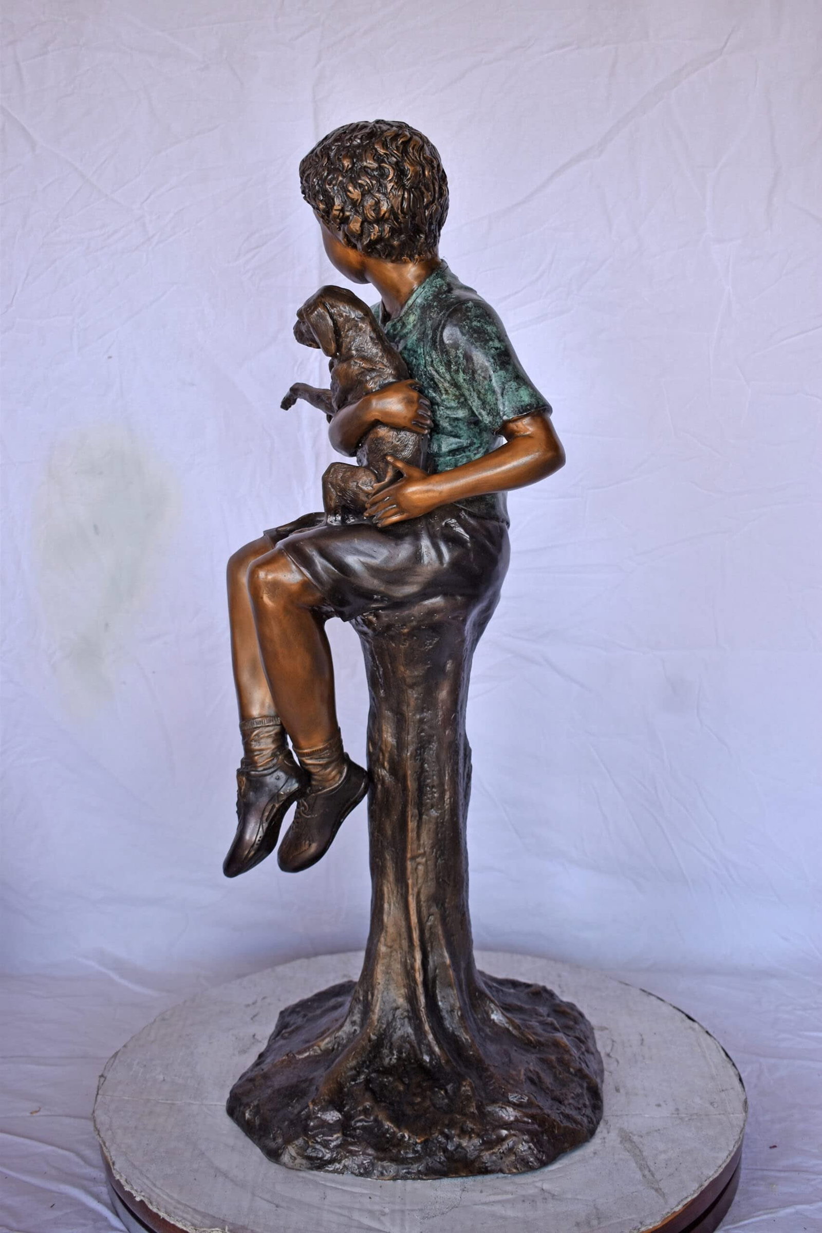 Boy Sitting on A Log with His Puppy Bronze Statue - Size: 15"L x 15"W x 35"H. - 4