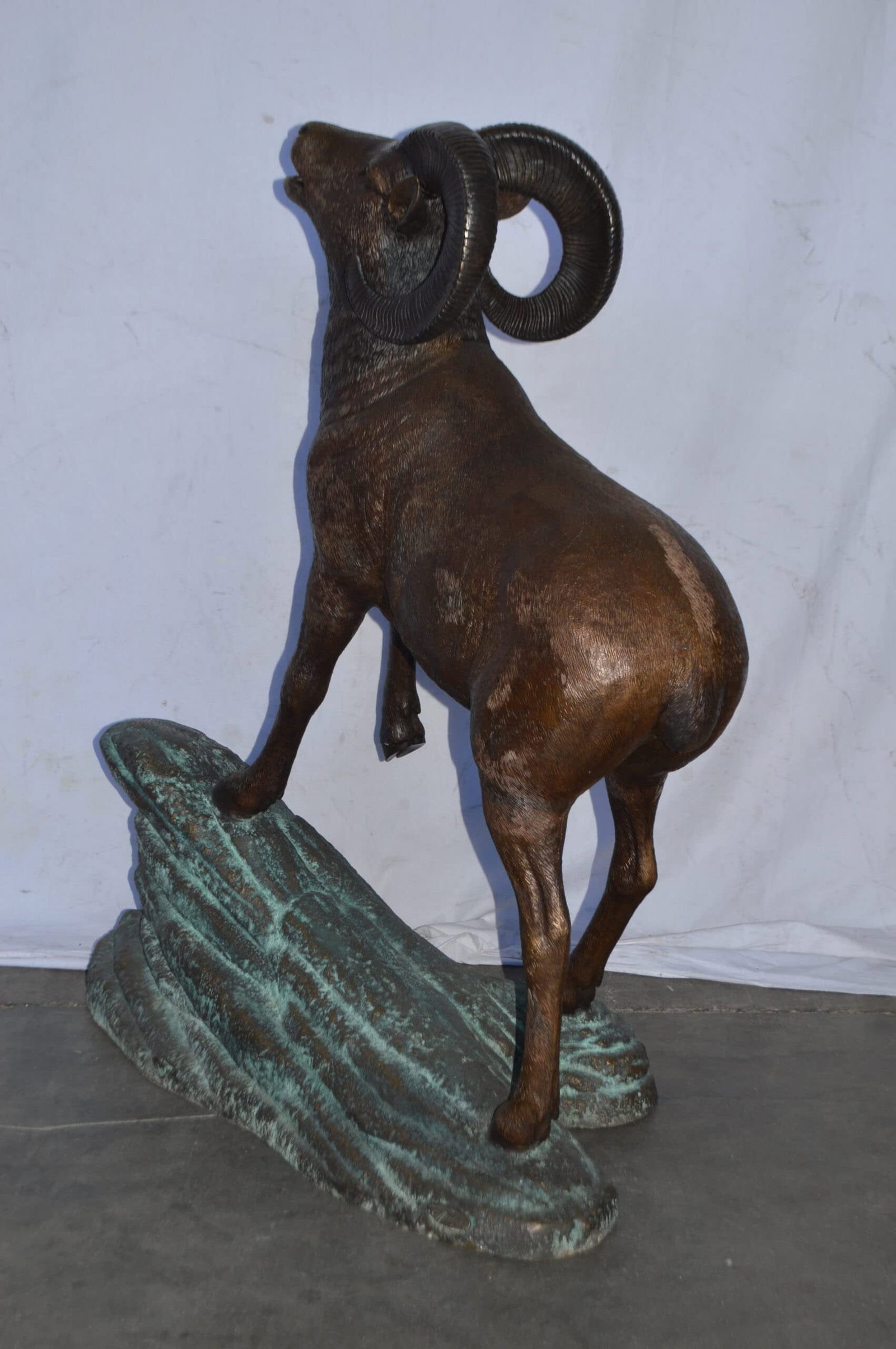 Life Size Ram standing on a rock Bronze Statue - Size: 38"L x 19"W x 45"H. - 10