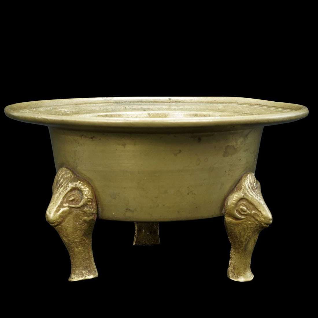 Sino-Tibetan Brass Censer w/Rams Head Legs: Title:Sino-Tibetan Brass Censer w/Rams Head LegsSize:4 in (10.2 cm) diameter x 3 in (7.6 cm) tall.Description:A small, but heavy, brass censer for lighting incense in the home. It may have once been