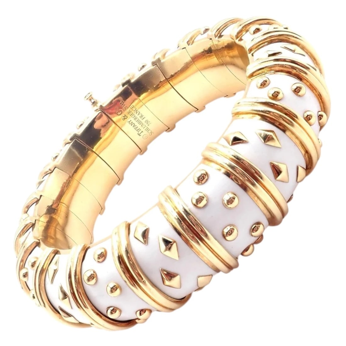 Tiffany & Co Schlumberger Dot Losange 18k Yellow Gold Enamel Bangle Bracelet: Tiffany & Co Schlumberger Dot Losange 18k Yellow Gold Enamel Bangle Bracelet About This Piece: This authentic Tiffany & Co. Jean Schlumberger Dot Losange bangle bracelet is a masterpiece of design and