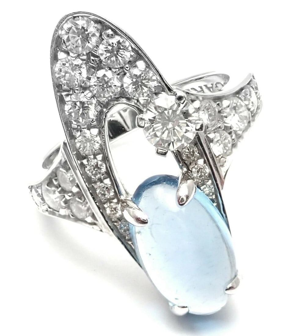 Rare! Authentic Bvlgari Bulgari Elysia 18k White Gold Diamond Blue Topaz Ring: Rare! Authentic Bvlgari Bulgari Elysia 18k White Gold Diamond Blue Topaz Ring About This Piece: Metal: 18k Yellow Gold Size: 6.25 Weight: Width: 6 grams 23mm Stones: 23 round brilliant cut diamonds VS