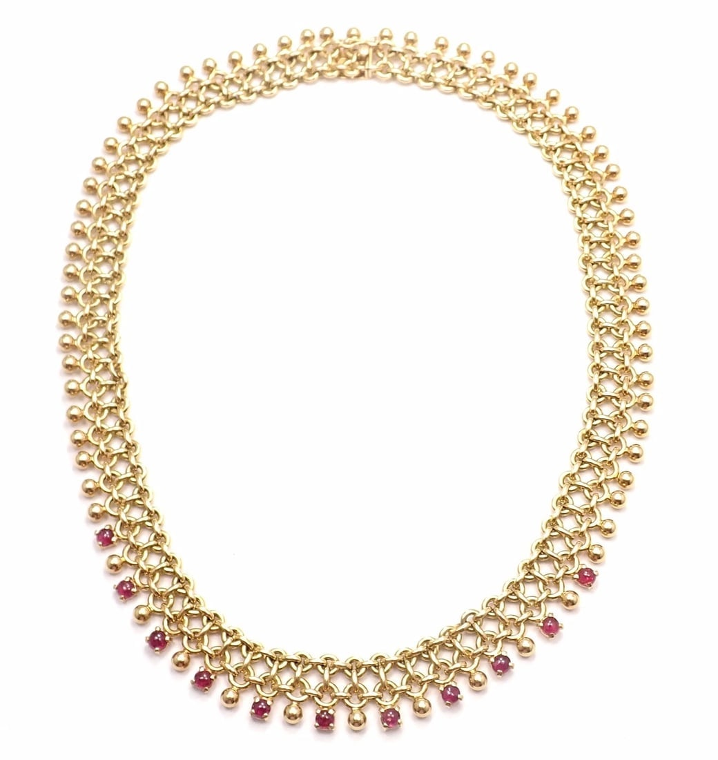 Rare! Vintage Authentic Tiffany & Co 18k Yellow Gold Ruby Collar Necklace: Rare! Vintage Authentic Tiffany & Co 18k Yellow Gold Ruby Collar Necklace About This Piece: Metal: 18k Yellow Gold Length: 16" Weight: Width: 77.1 grams 15mm Stones: 11 round rubies total weight appro