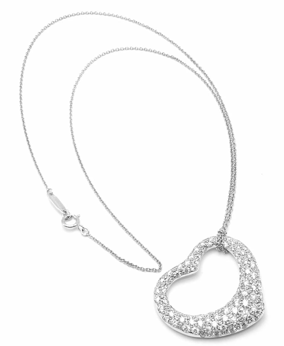 Authentic Tiffany & Co Peretti Platinum Diamond Large Open Heart Necklace $26000: Authentic Tiffany & Co Peretti Platinum Diamond Large Open Heart Necklace $26000 About This Piece: Retail Price: $26,000 plus tax. Metal: Platinum Measurements: Chain Length 16.5" Pendant: 27mm x 25mm