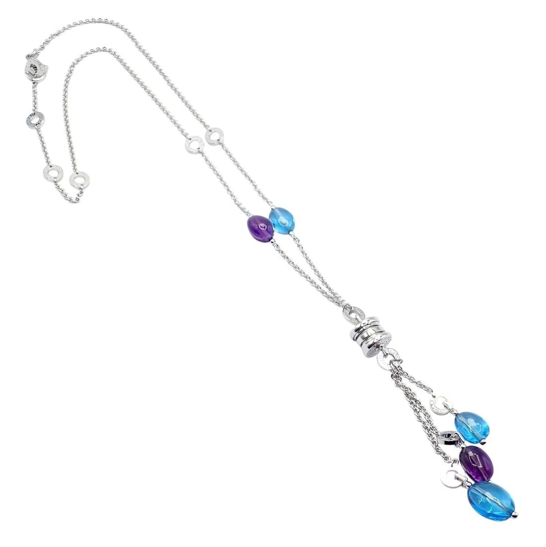 Bvlgari Bulgari 18k White Gold Amethyst Blue Topaz Lavalier B.Zero1 Necklace: Bvlgari 18k white gold lavalier necklace featuring vibrant amethyst and blue topaz stones elegantly spaced along a delicate chain. A signature Bvlgari pendant anchors cascading gemstone drops, creatin