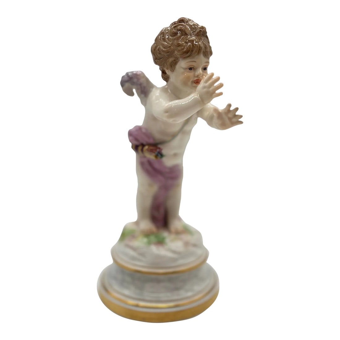 Antique Meissen Porcelain Model L125 Figure of a Cupid Mocking: Meissen, 19th century. A fine quality Meissen porcelain figure featuring a cupid figure draped in a purple cloth with petite wings and very realistic features. This piece was designed by the famous