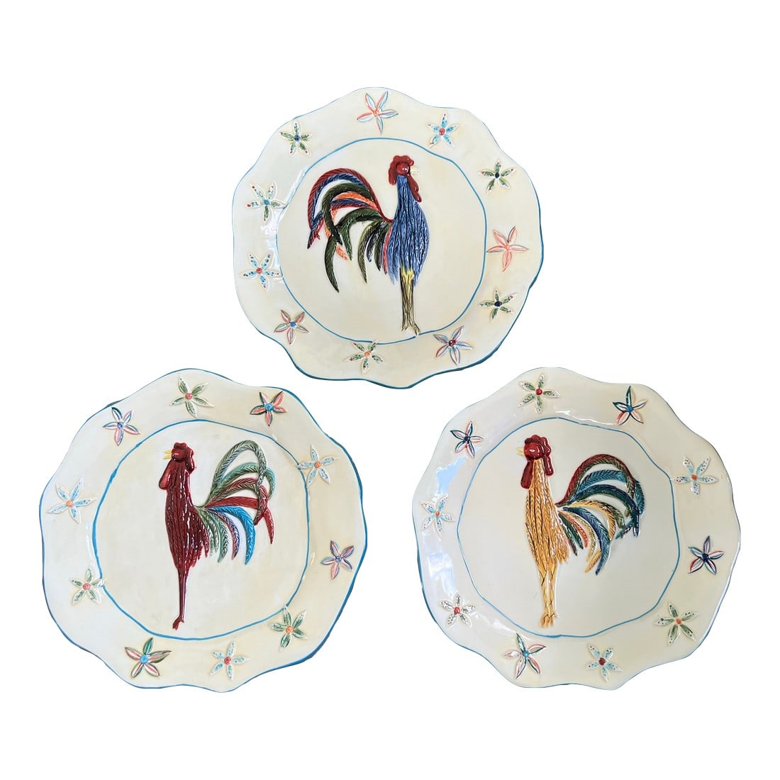Whimsical Rooster Plates Set of 3: Colorful rooster plates by artist Cindy Shamp. The roosters are raised as well as the flowers in the border. Love the whimsical look of these plates with the bright colors and wavy border. 